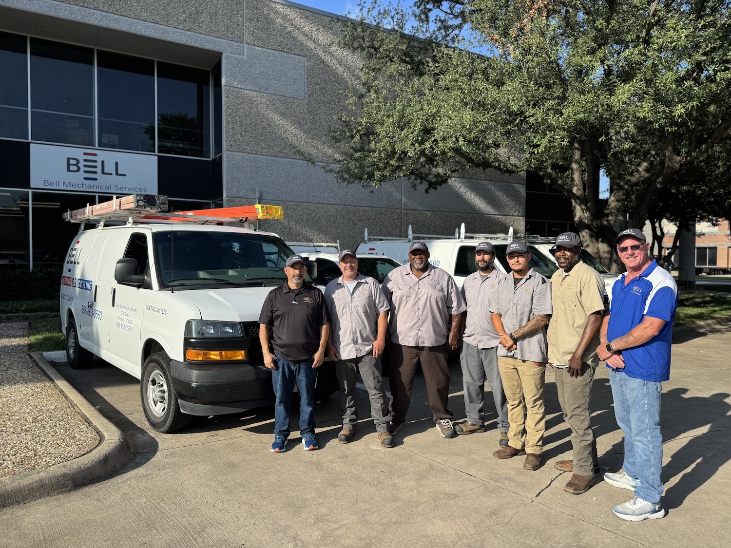 Bell Mechanical Services team member servicing residential HVAC equipment