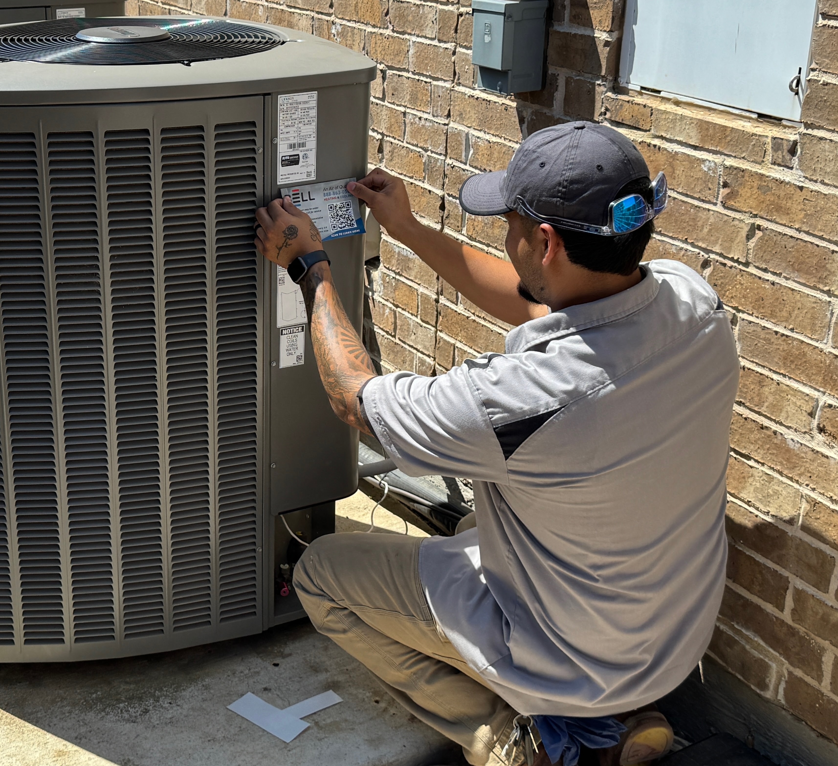 Bell Mechanical Services technician at work on an HVAC system