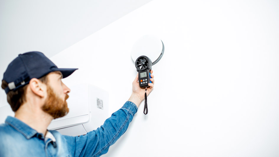 A homeowner reviews indoor air quality concerns during a home energy assessment