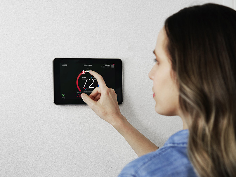 Family at home enjoying precise, programmable comfort